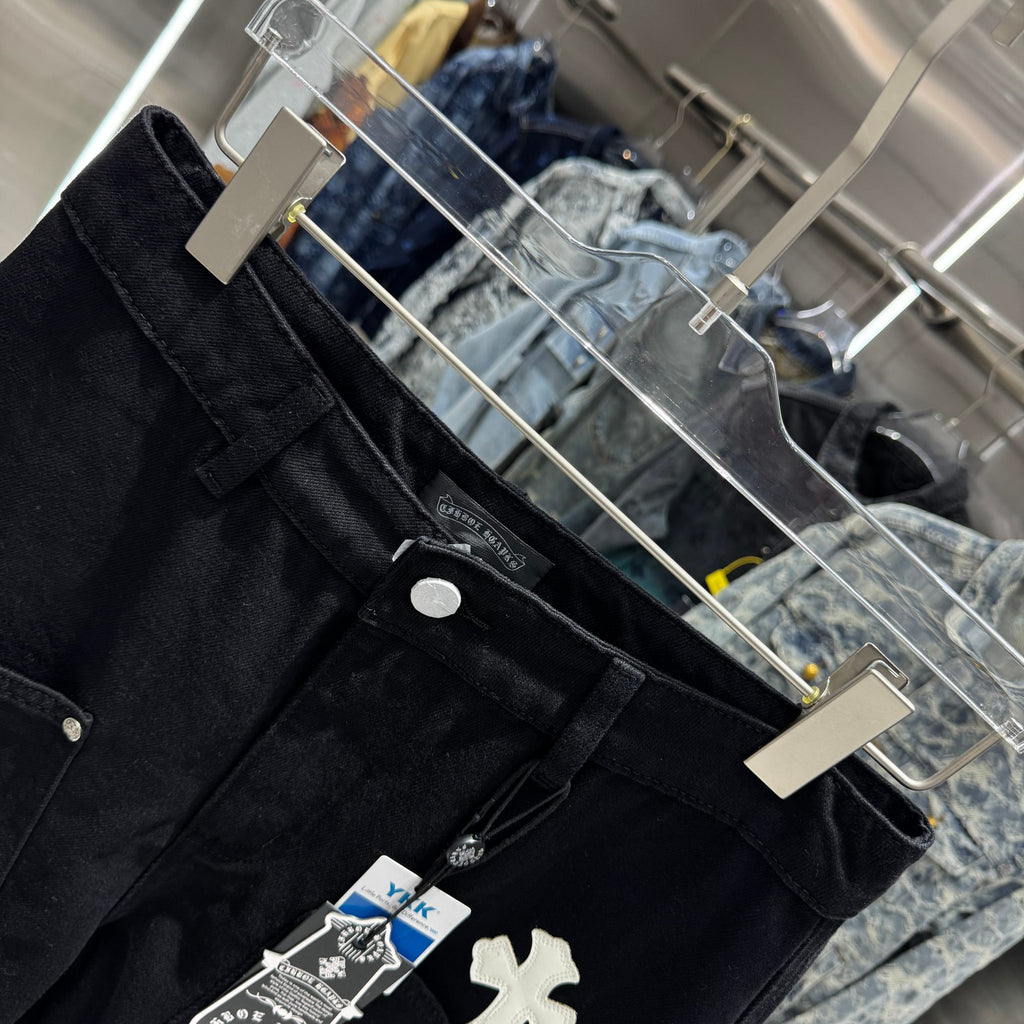 Embroidered cross denim shorts with torn holes