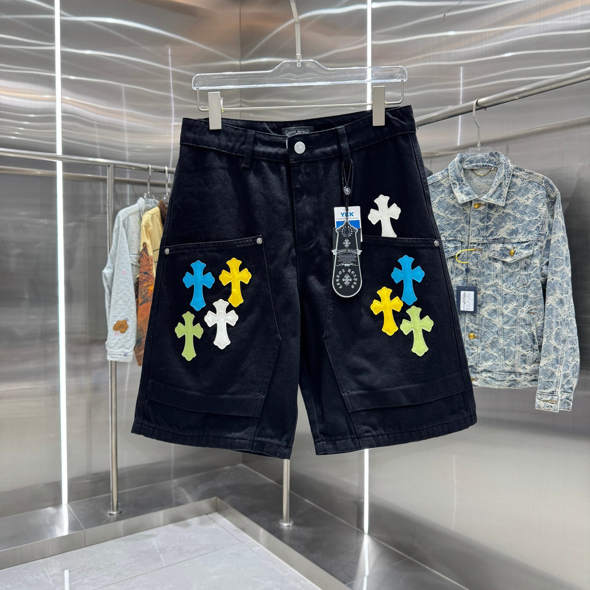 Embroidered cross denim shorts with torn holes