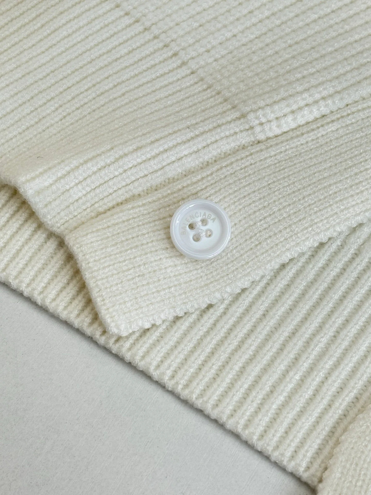 Knitted cardigan sweater with armband