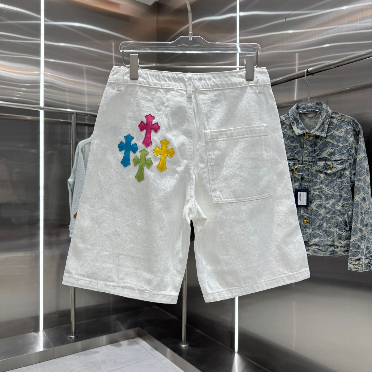 Embroidered cross denim shorts with torn holes
