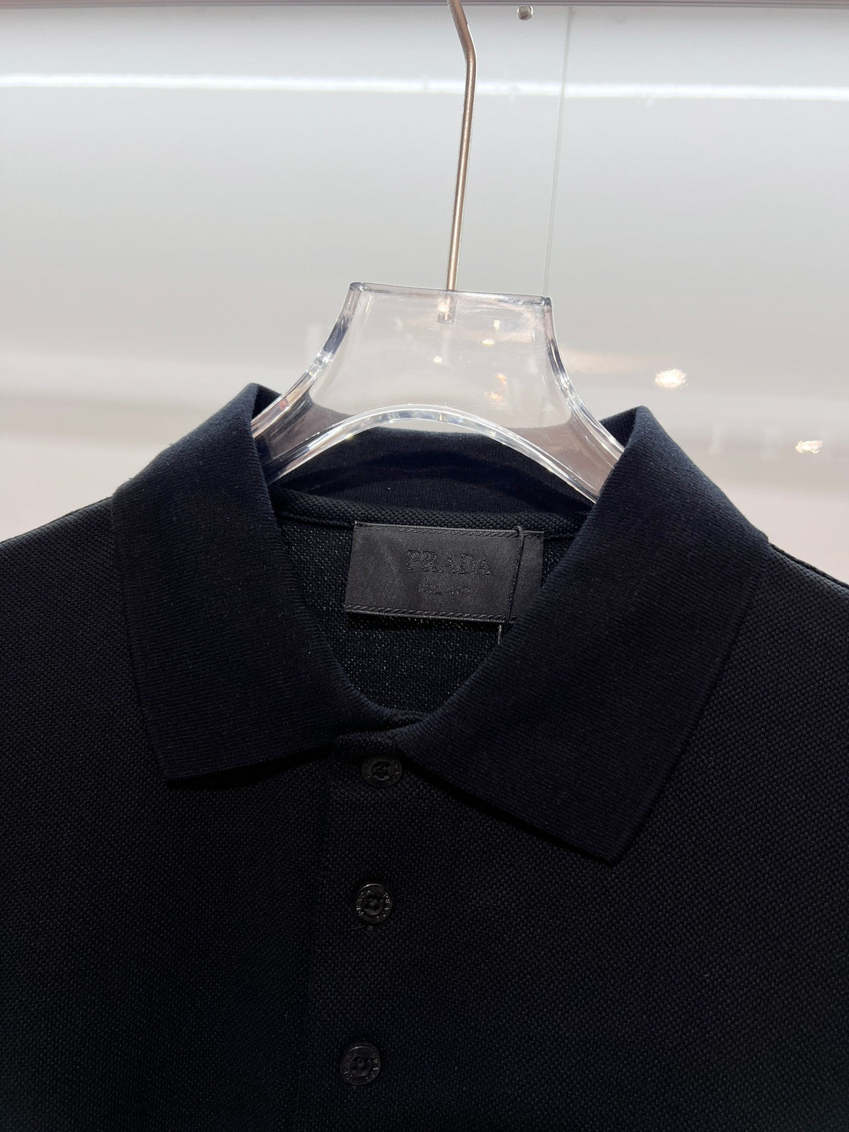 Chest pocket with metal triangle logo, leather seal, letter polo shirt