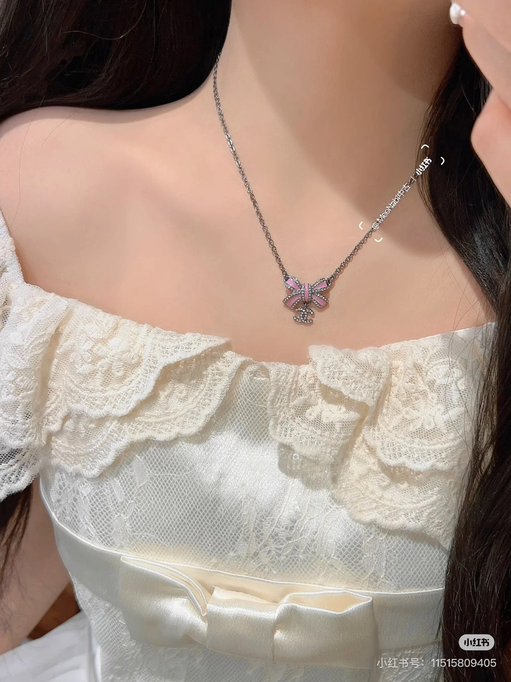 Black gold iridescent enamel bow necklace