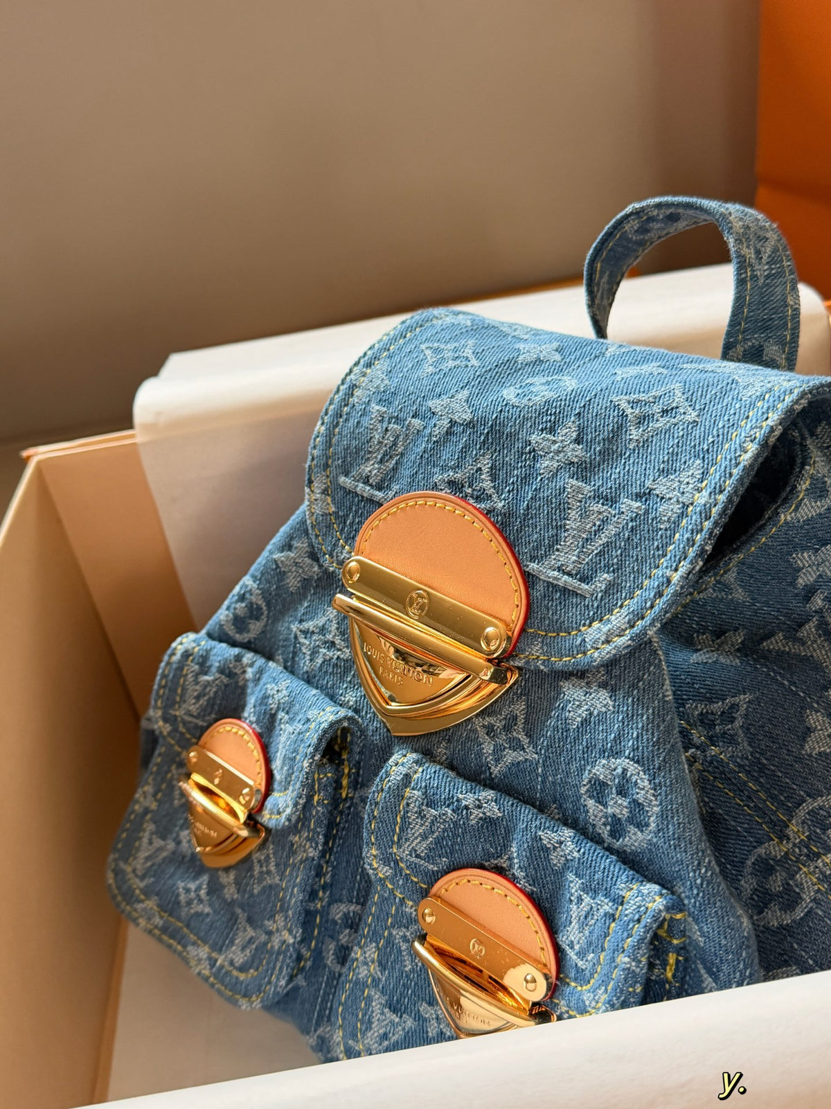 Blue denim double pocket triangular buckle backpack