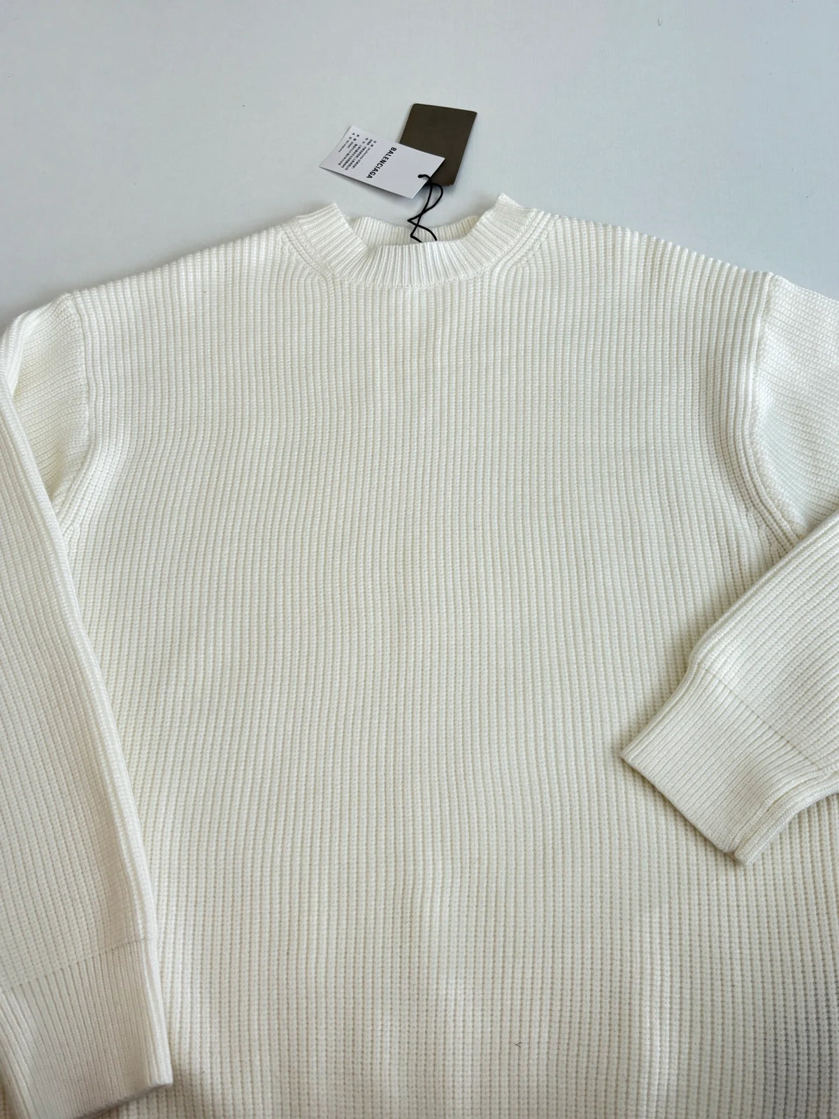 Knitted round neck sweater with armband