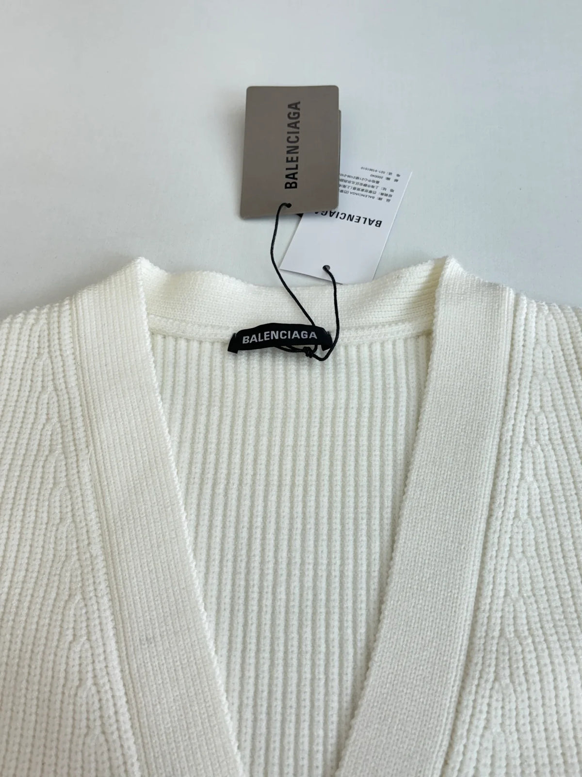 Knitted cardigan sweater with armband
