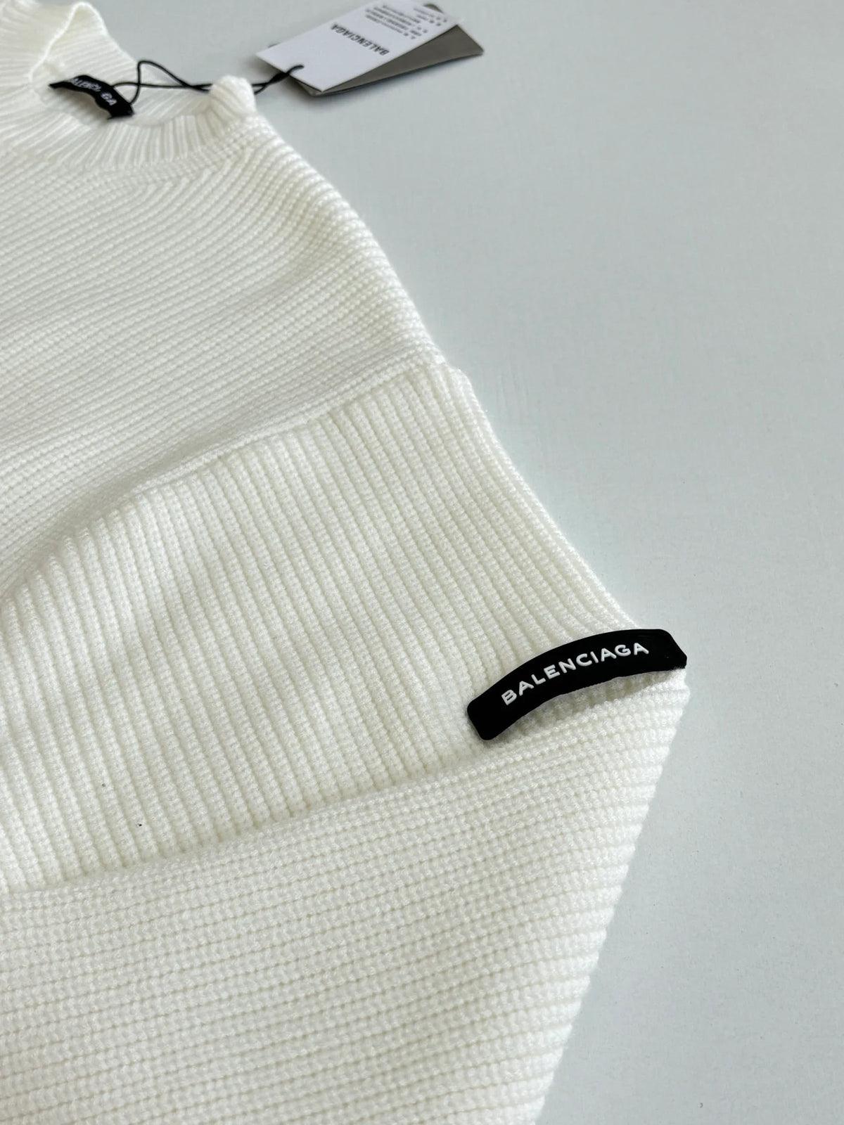 Knitted round neck sweater with armband
