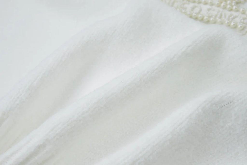 Embroidered pearl micro label round neck sweater