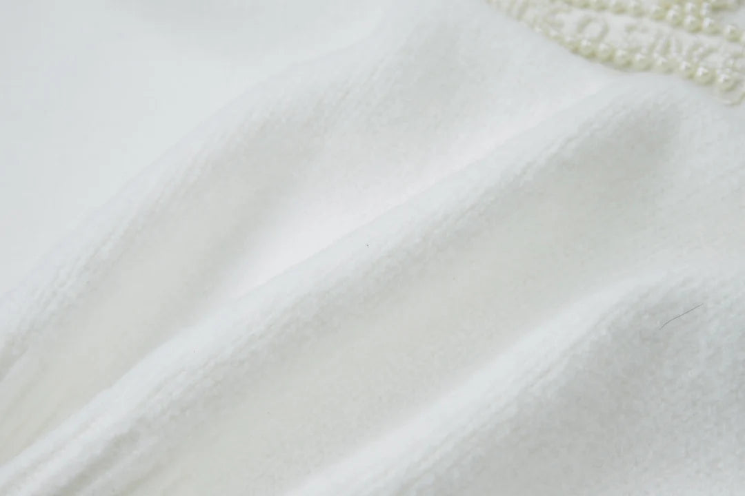 Embroidered pearl micro label round neck sweater