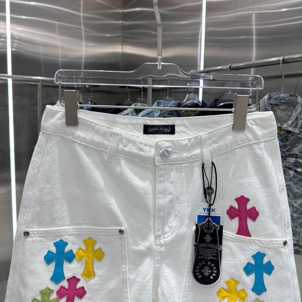 Embroidered cross denim shorts with torn holes