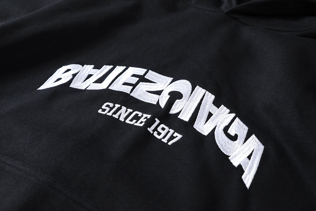 Reverse garbled letter embroidery hooded sweatshirt
