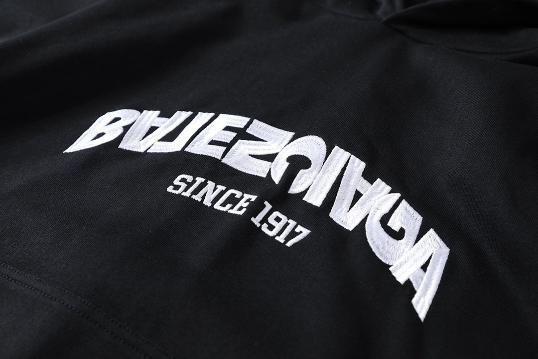 Reverse garbled letter embroidery hooded sweatshirt