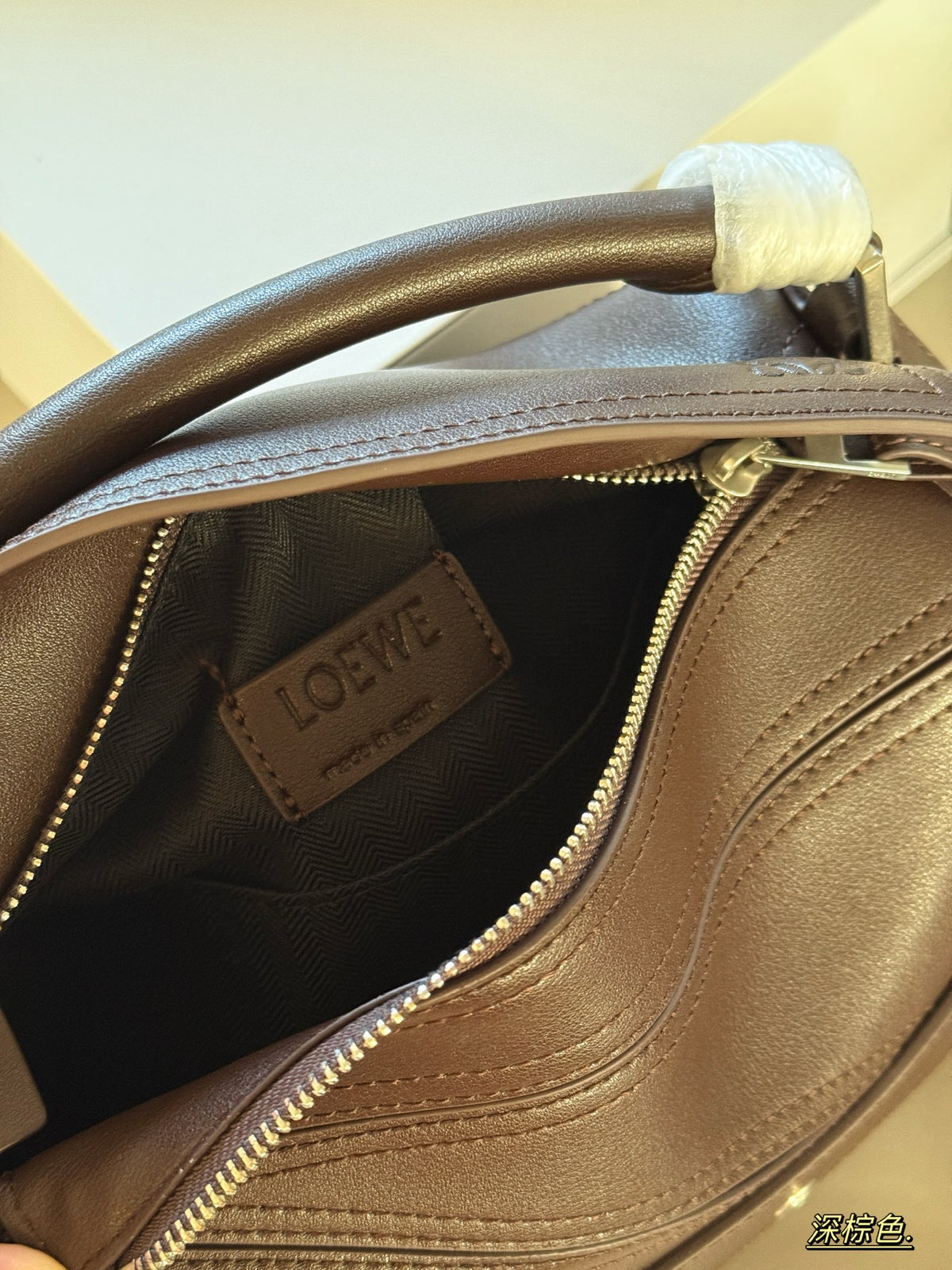 Geometric belt buckle wrapped in cowhide