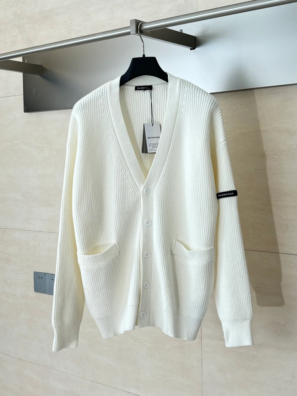 Knitted cardigan sweater with armband