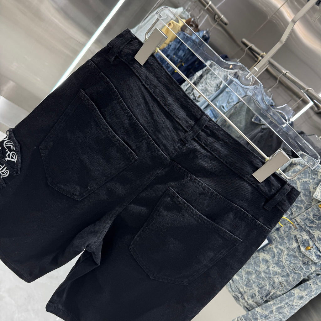 Embroidered cross denim shorts with torn holes