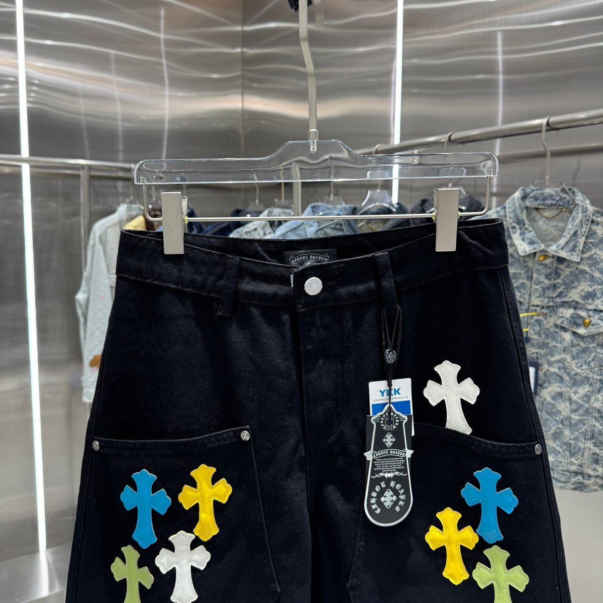 Embroidered cross denim shorts with torn holes