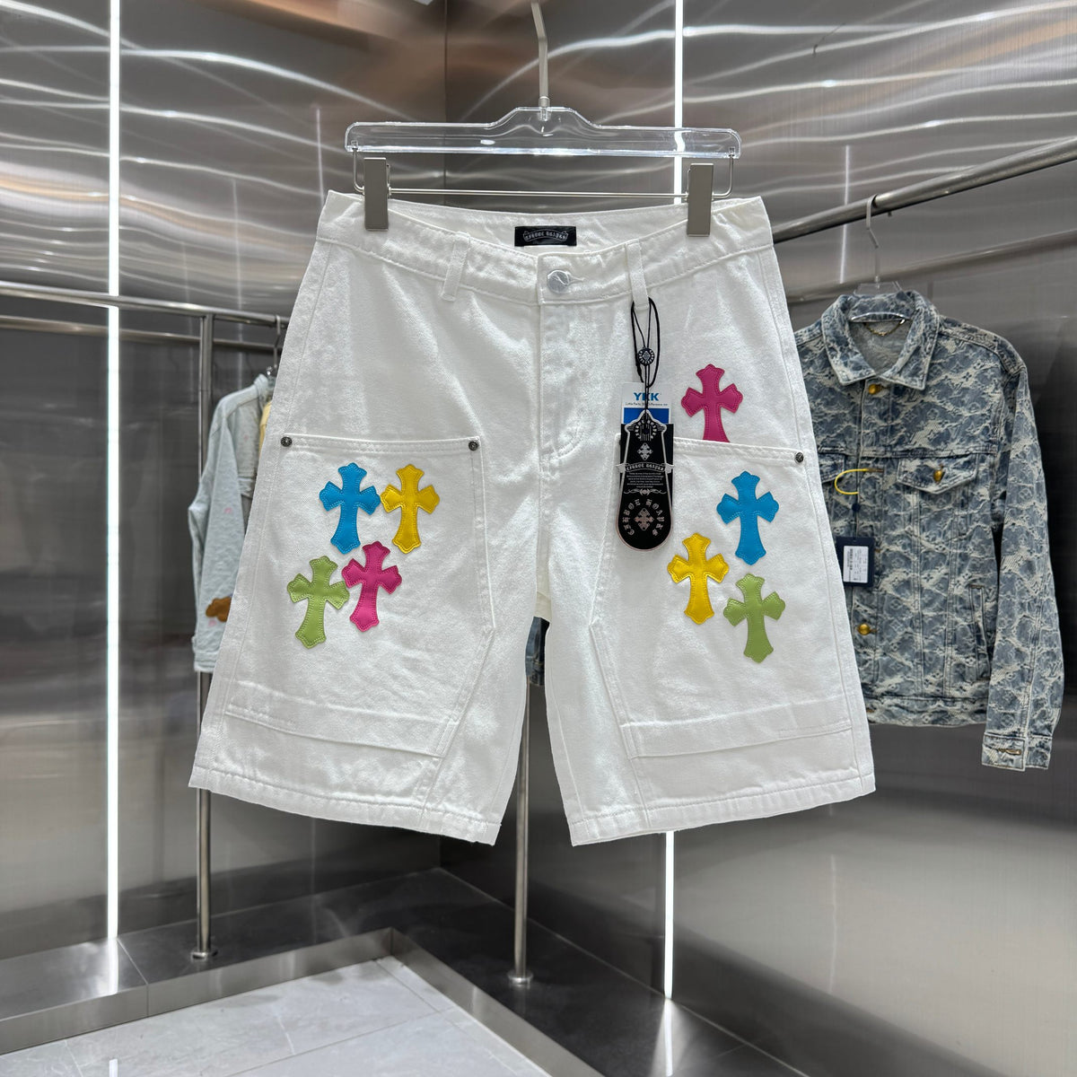 Embroidered cross denim shorts with torn holes