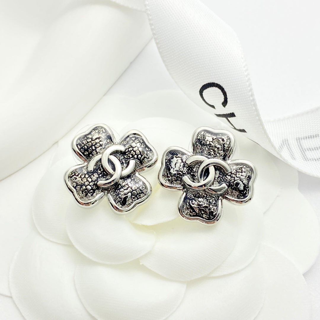 Black gold lace clover earrings