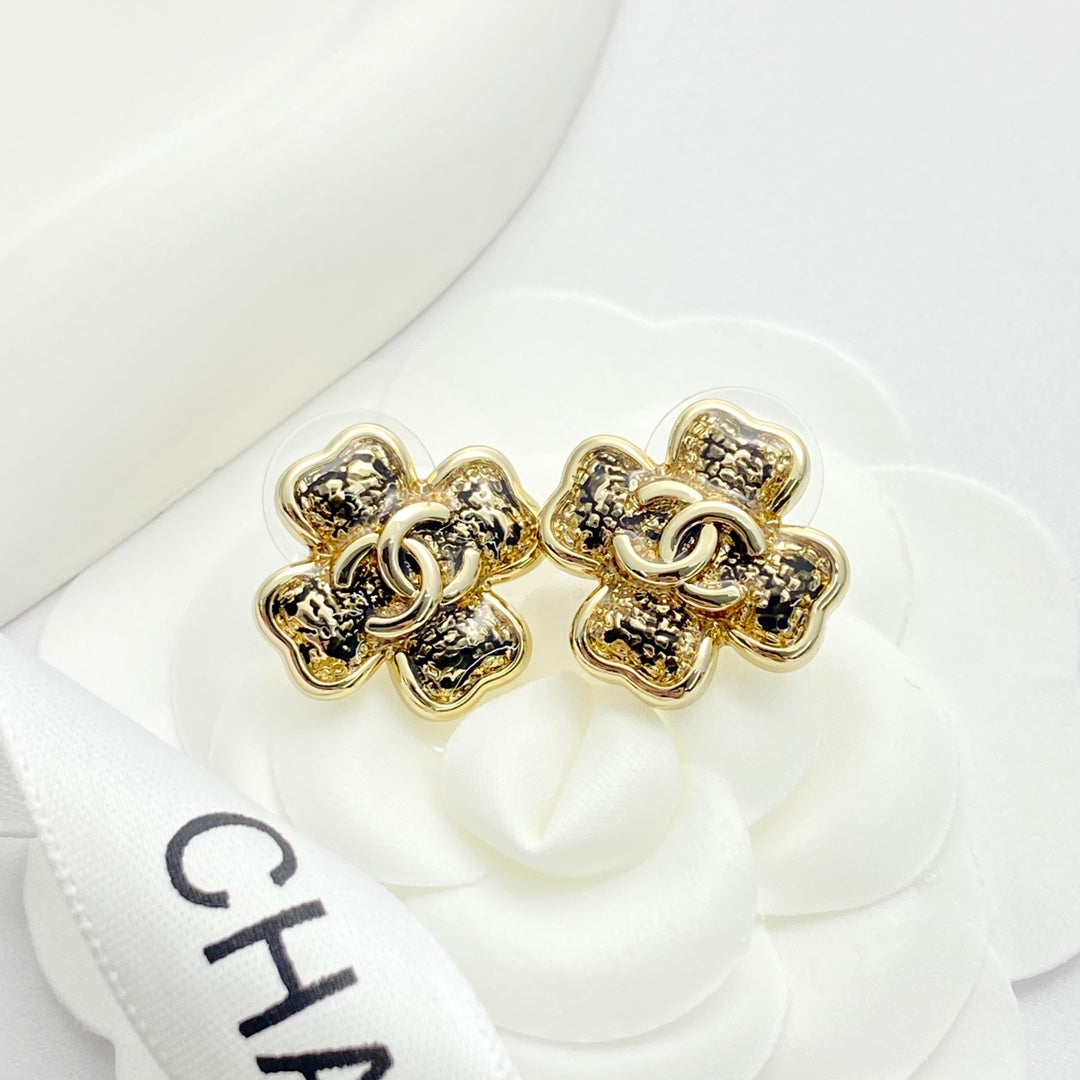 Black gold lace clover earrings