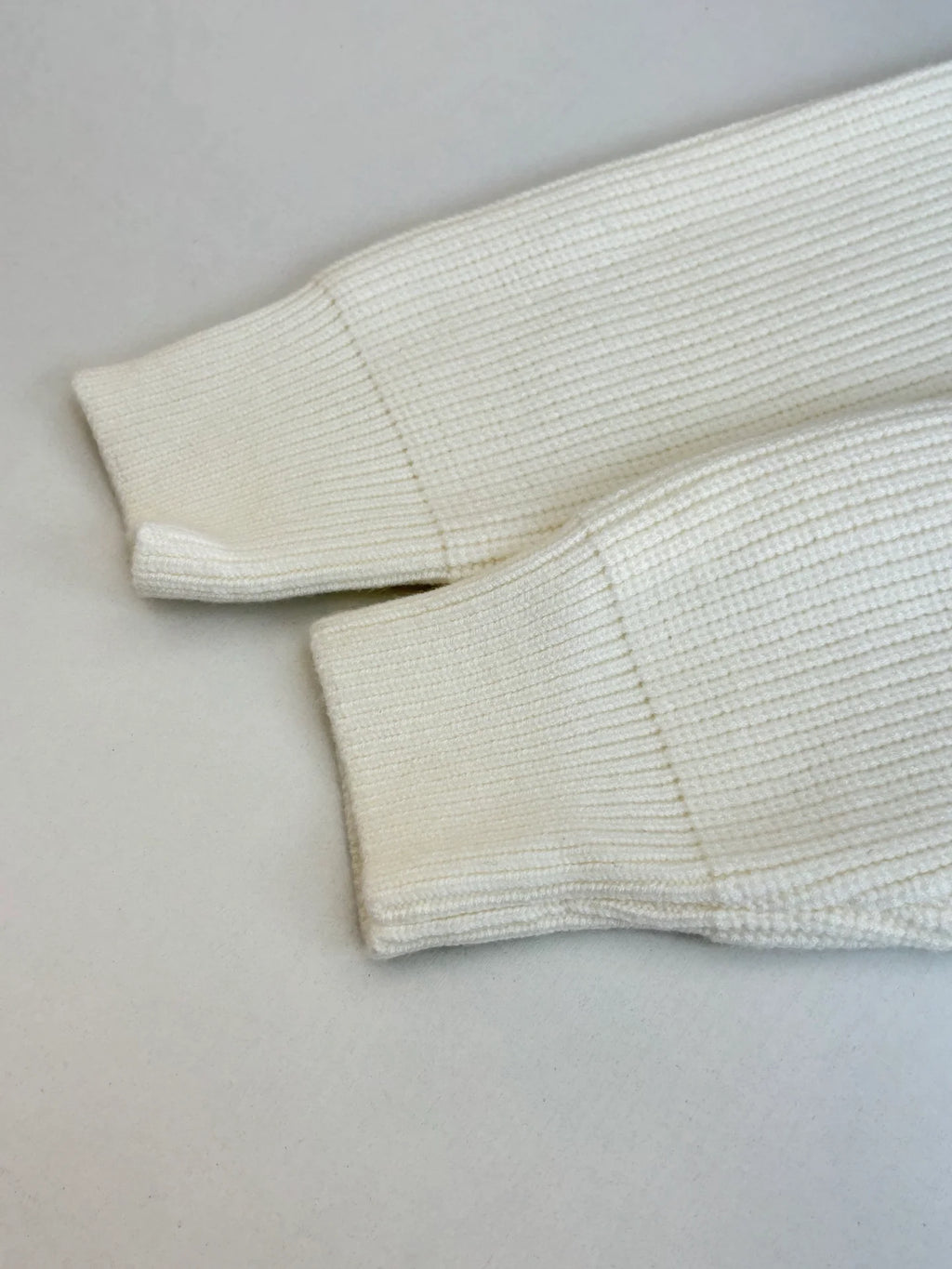 Knitted cardigan sweater with armband