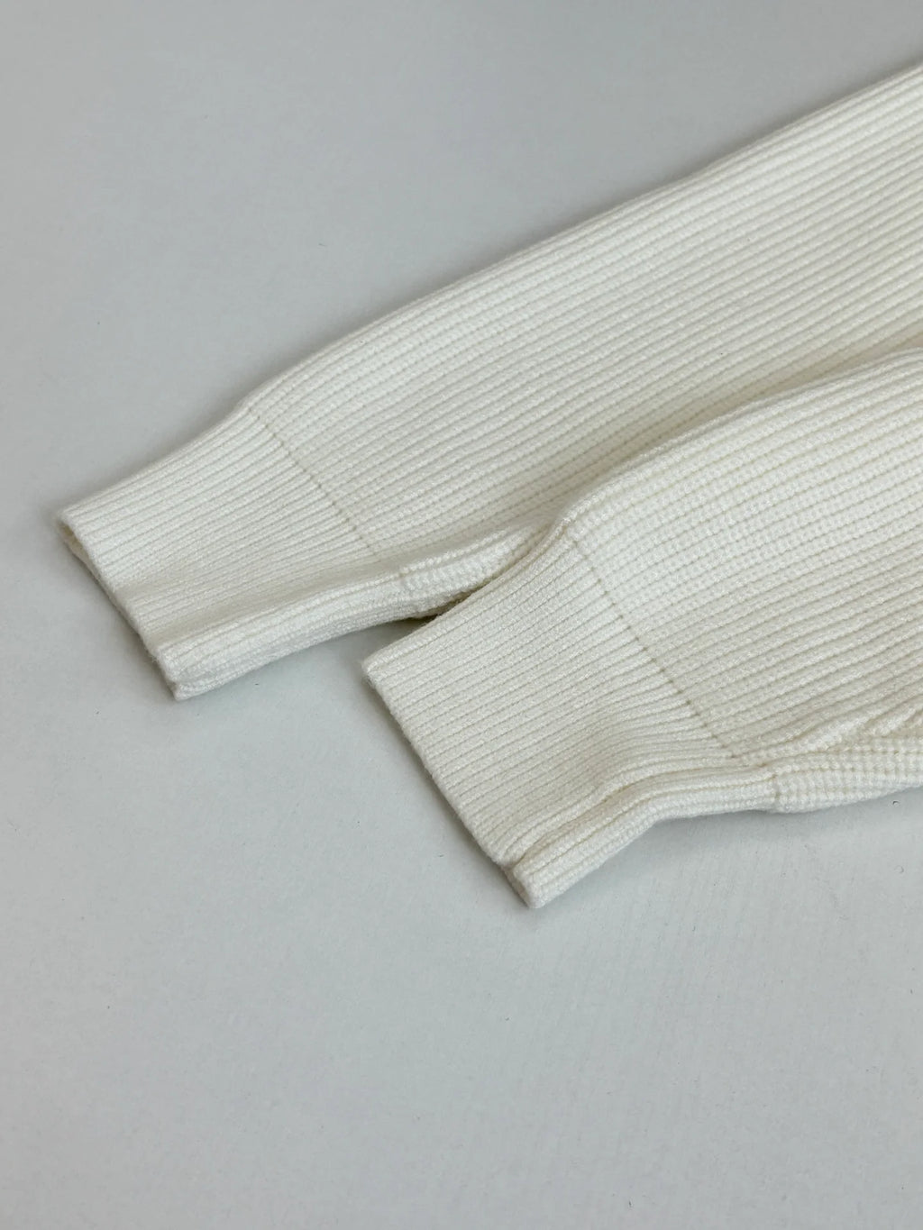 Knitted round neck sweater with armband