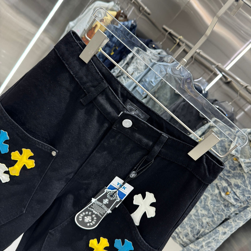 Embroidered cross denim shorts with torn holes