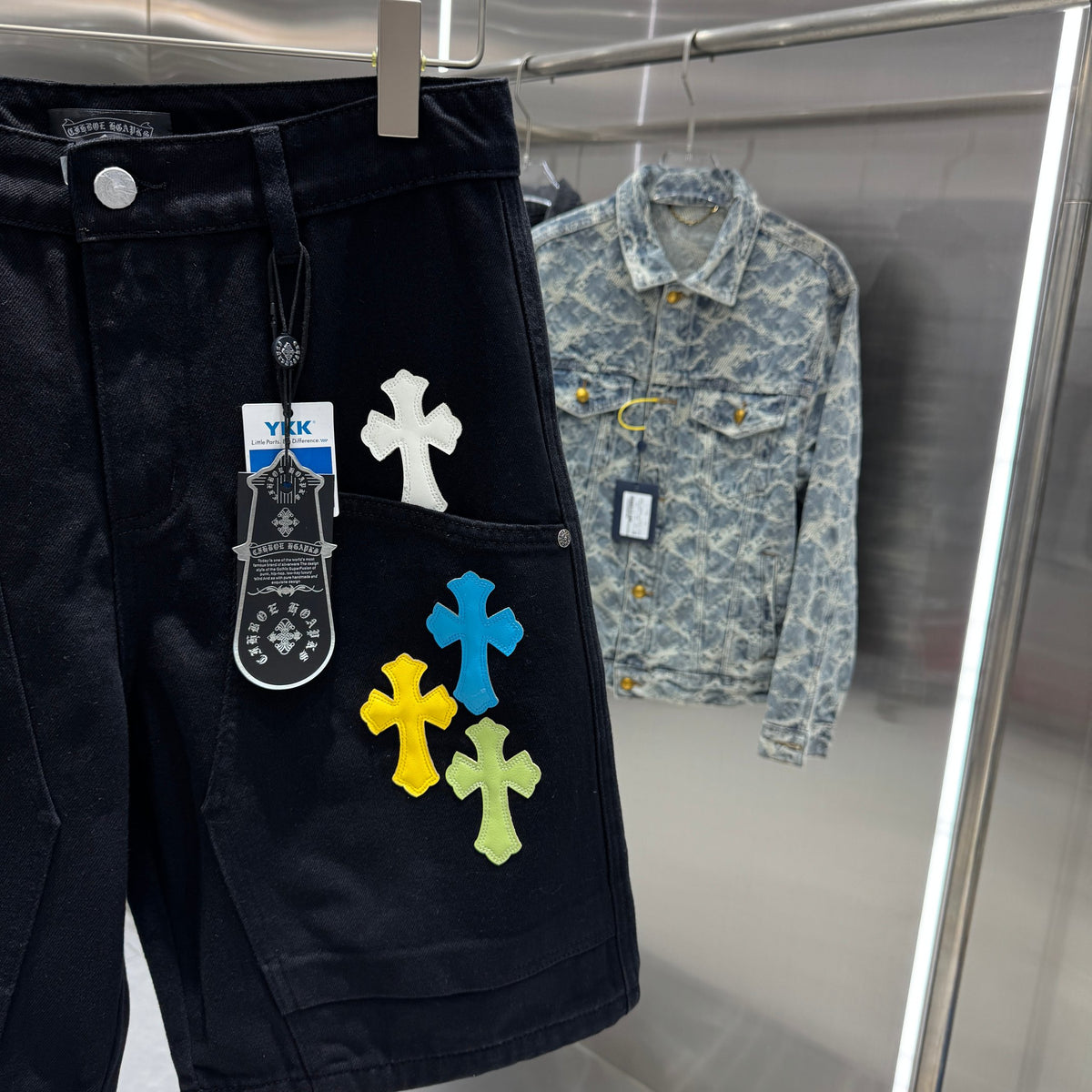 Embroidered cross denim shorts with torn holes