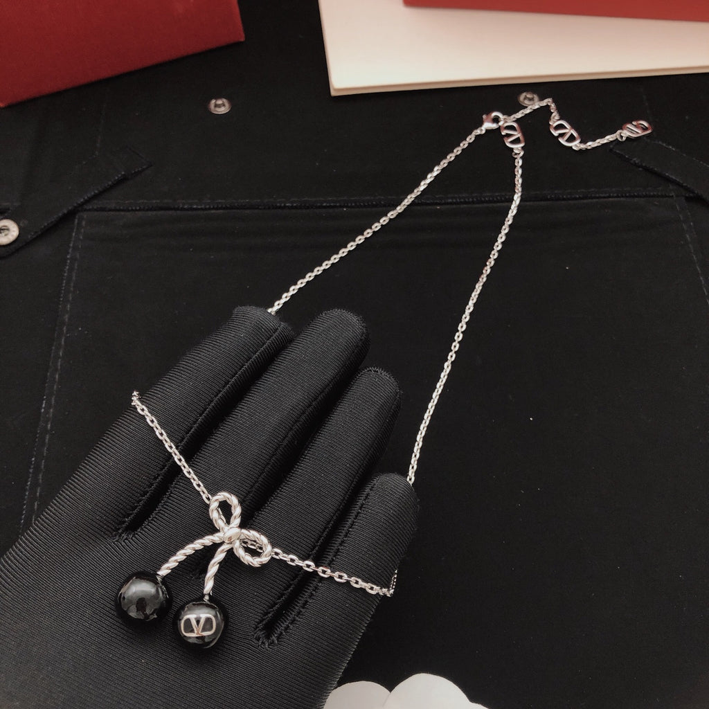 Black cherry bow necklace