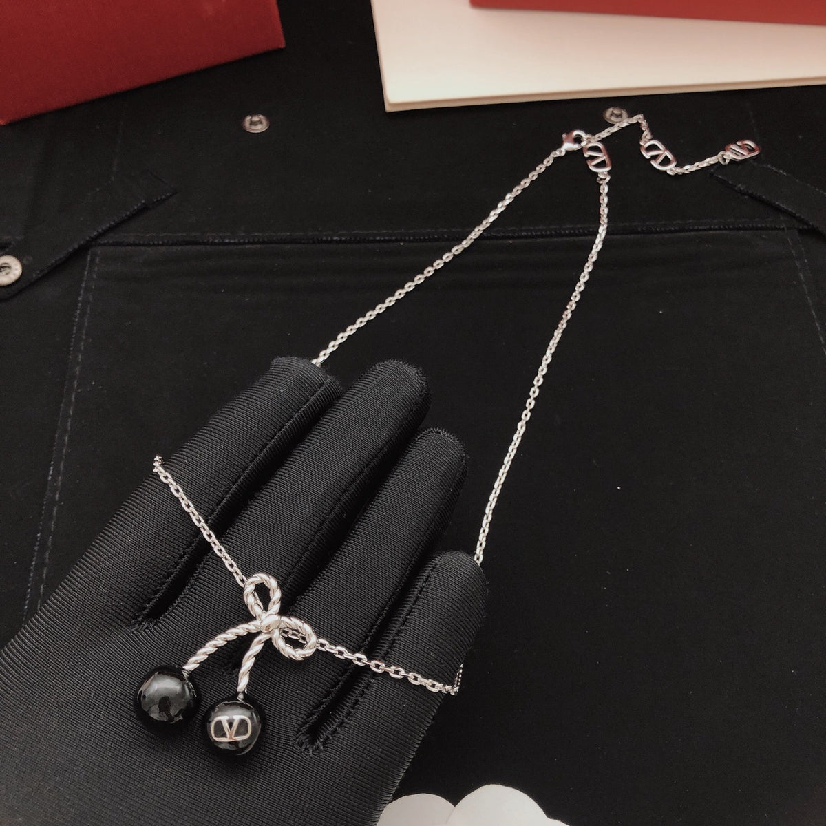 Black cherry bow necklace
