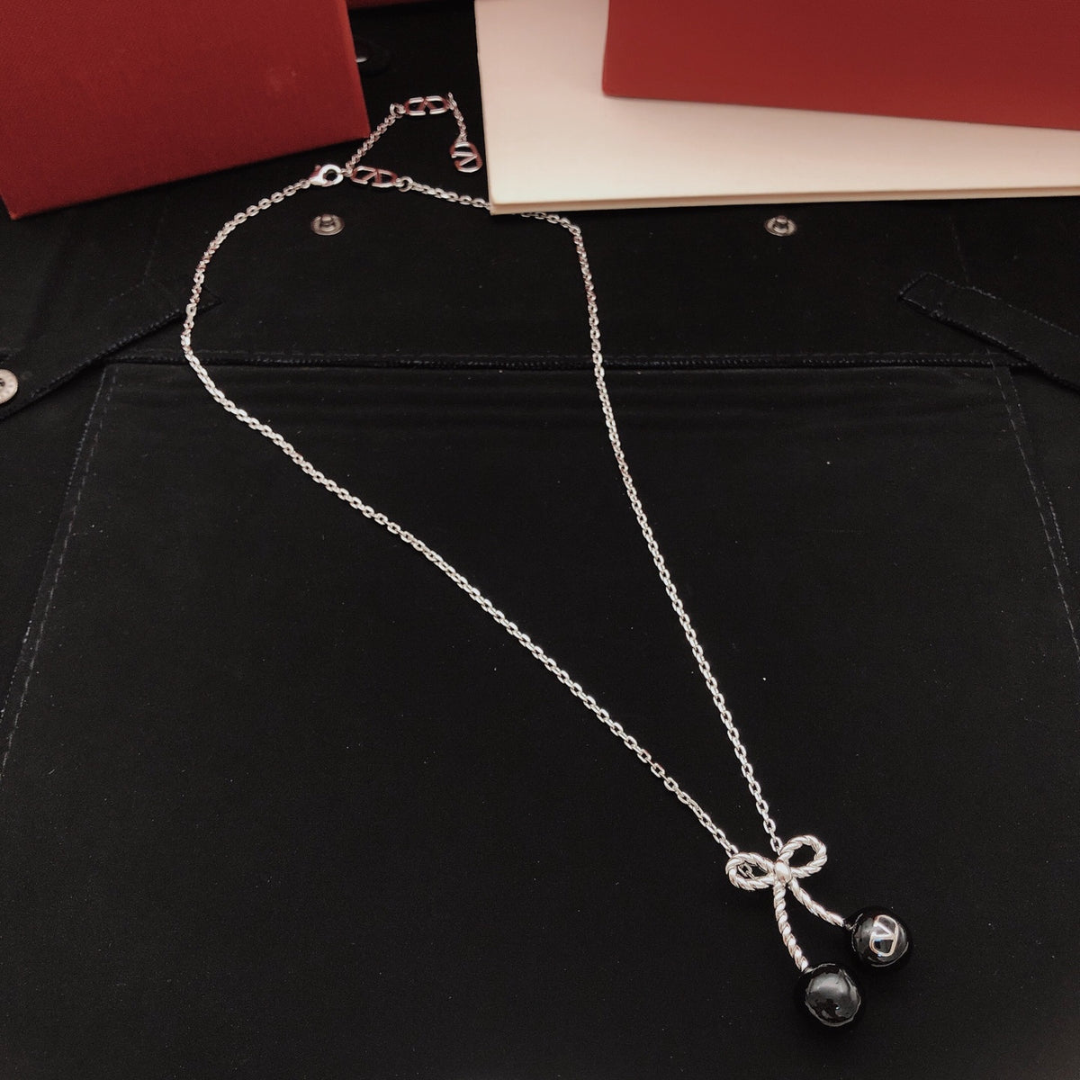 Black cherry bow necklace