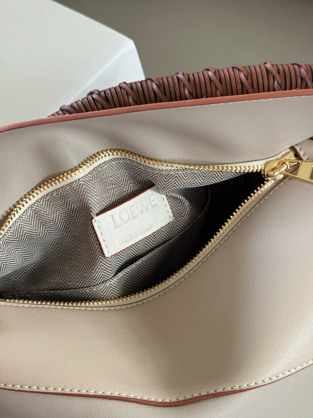 Woven handle, color blocked geometric bag, cowhide