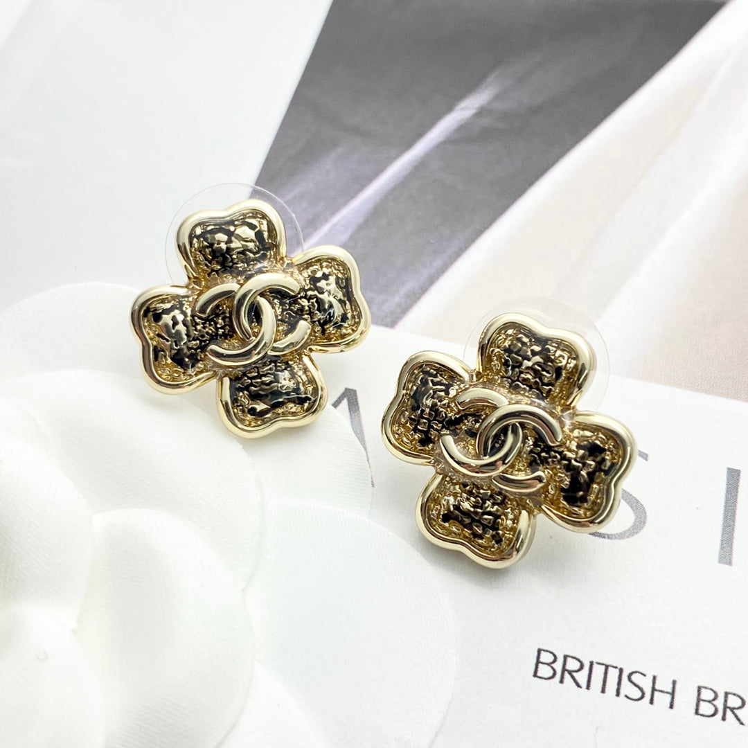 Black gold lace clover earrings