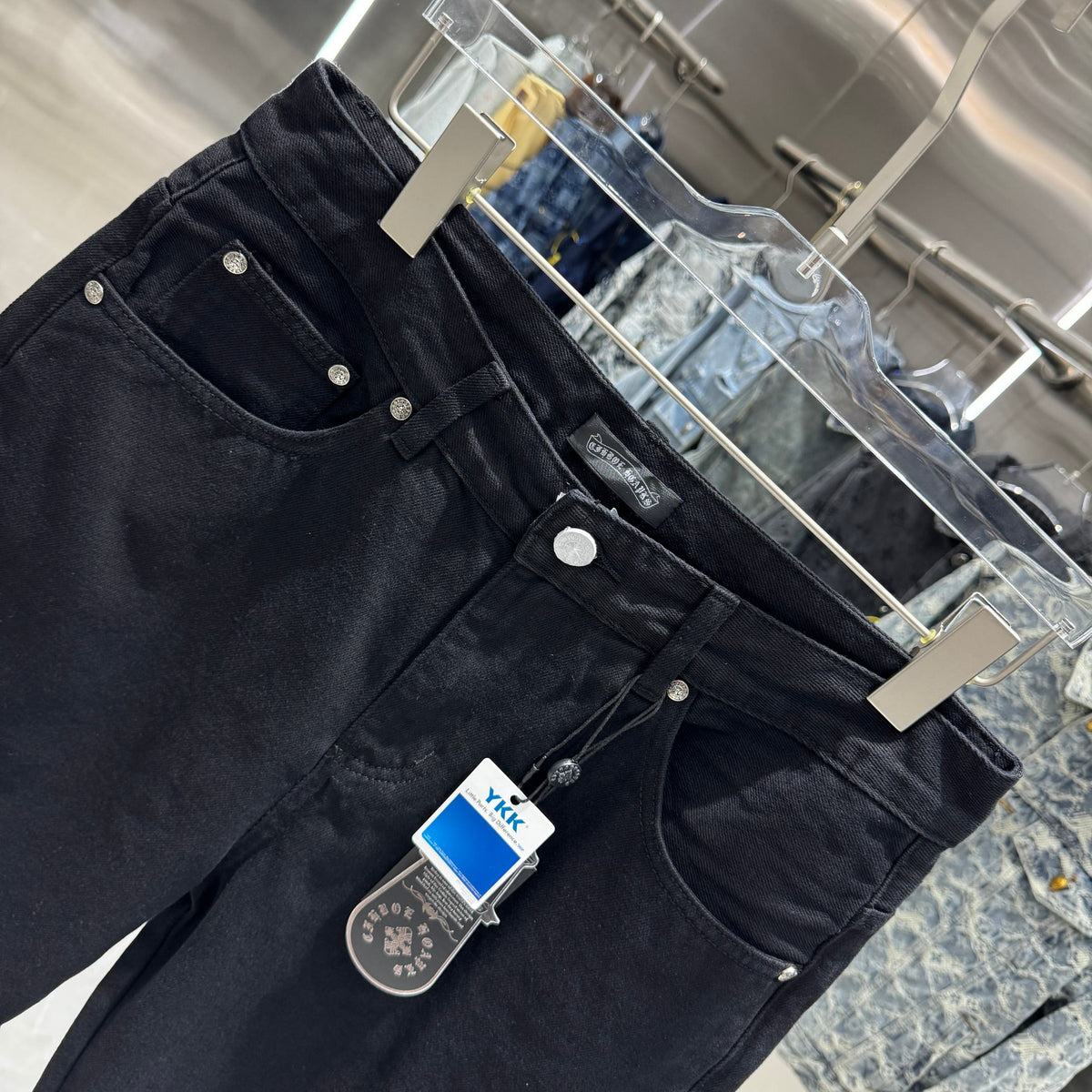 Embroidered cross denim shorts with torn holes