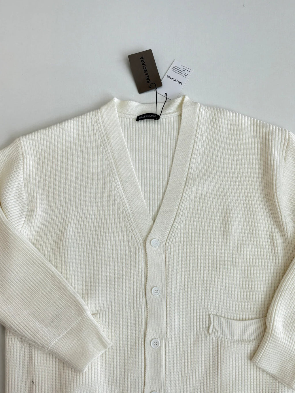 Knitted cardigan sweater with armband
