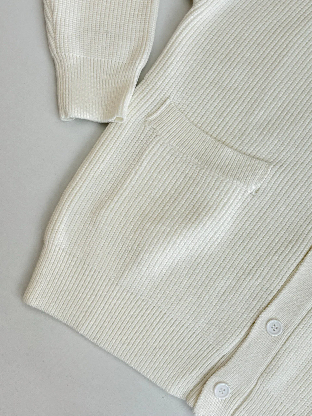 Knitted cardigan sweater with armband