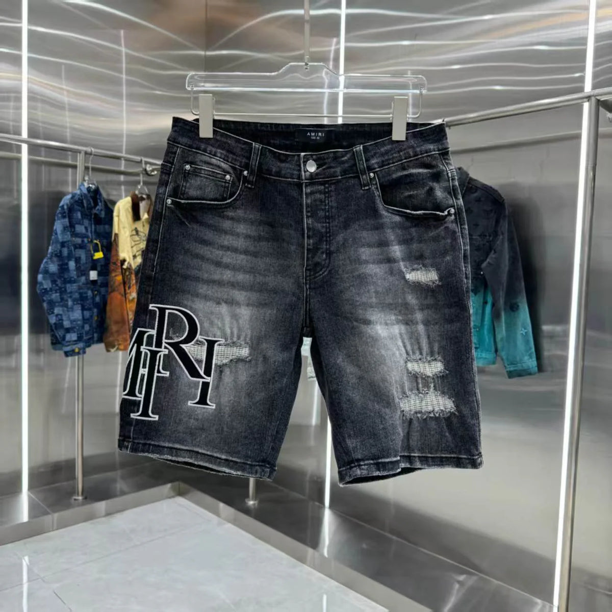 Ripped letter embroidered jeans