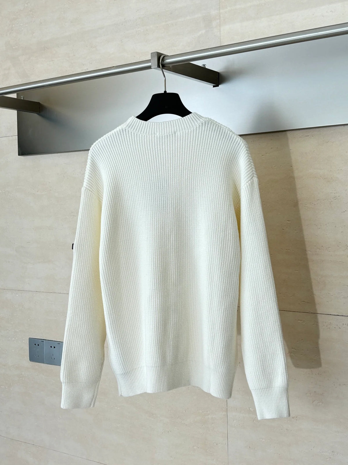 Knitted round neck sweater with armband