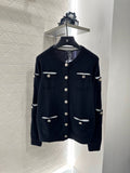 C 25 Multi-button knitted cardigan