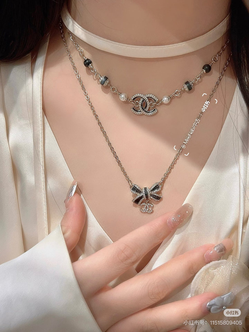 Black gold iridescent enamel bow necklace