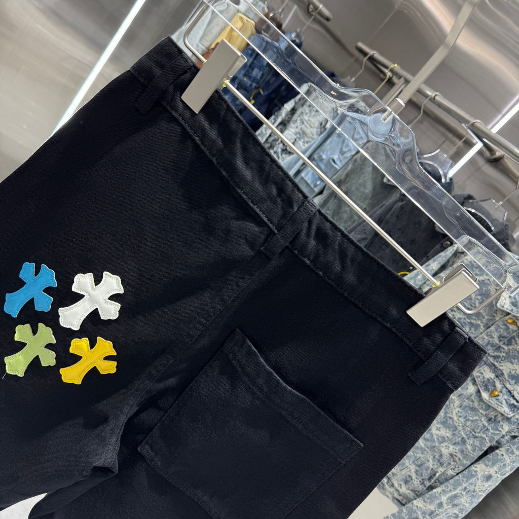 Embroidered cross denim shorts with torn holes