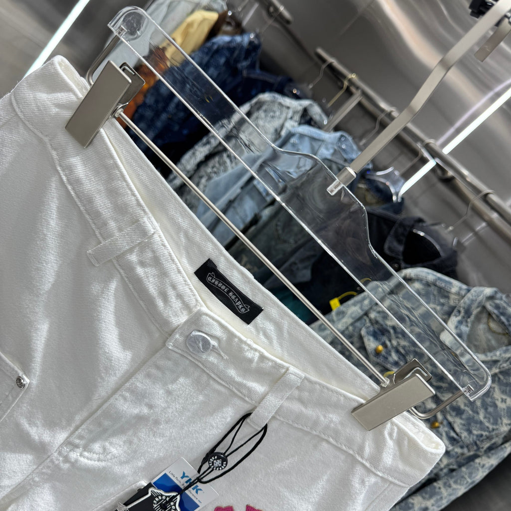 Embroidered cross denim shorts with torn holes