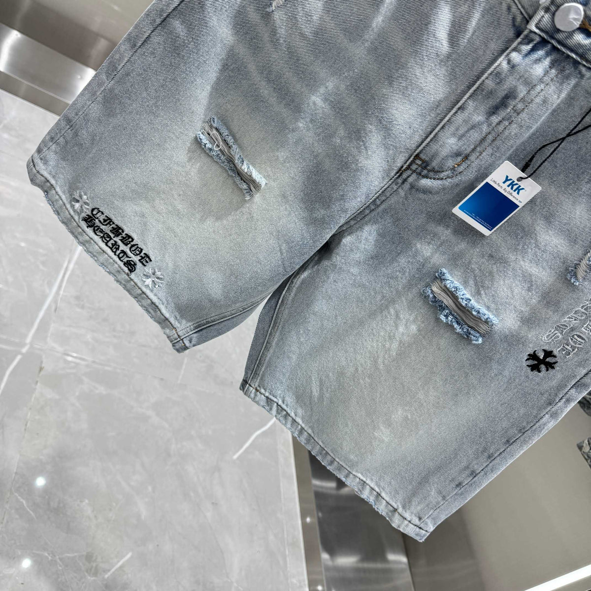 Spliced cross denim shorts