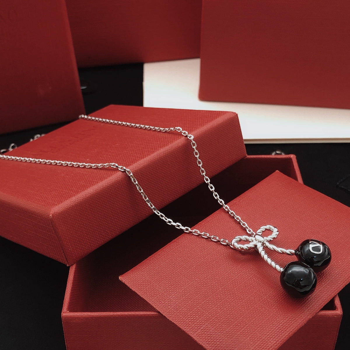 Black cherry bow necklace