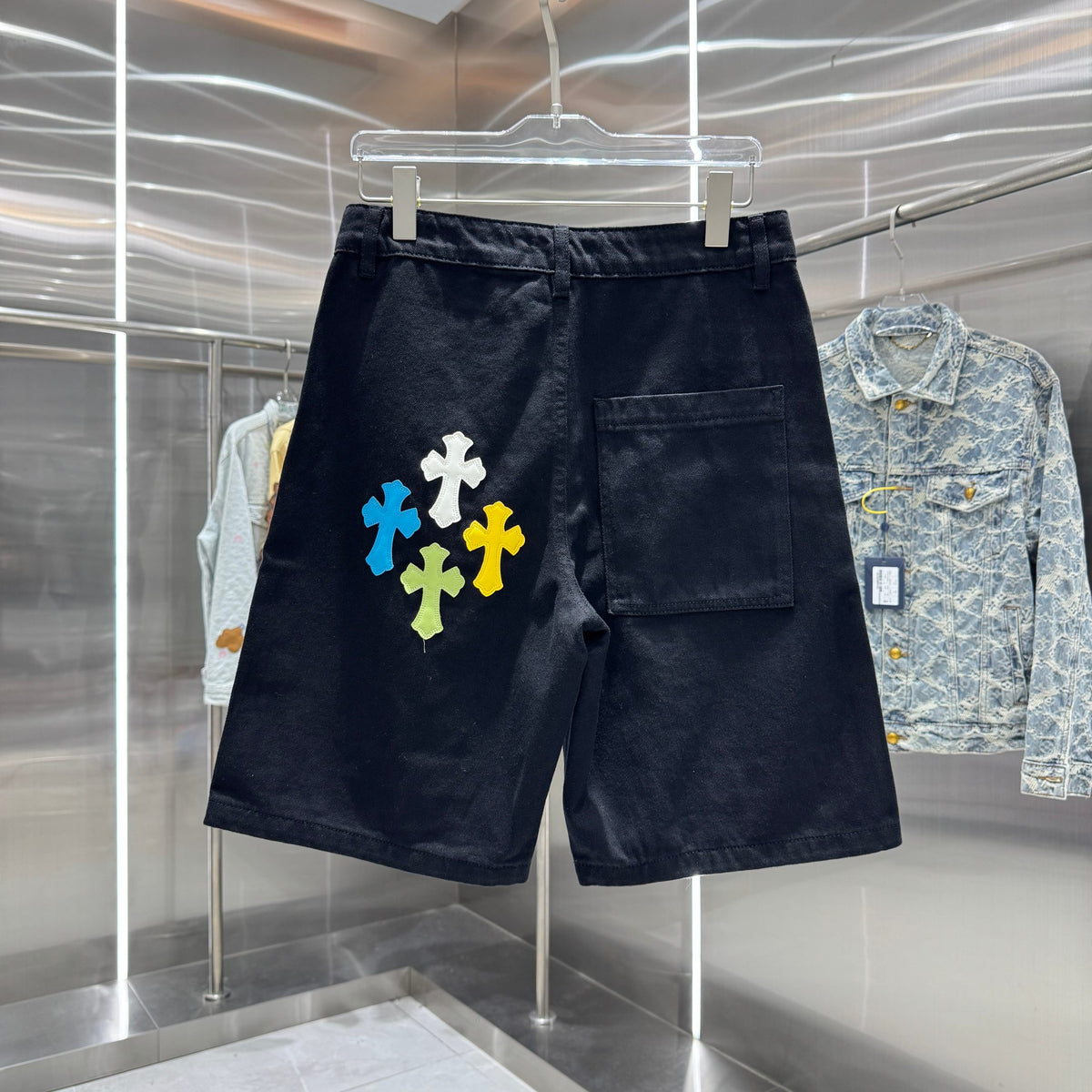 Embroidered cross denim shorts with torn holes