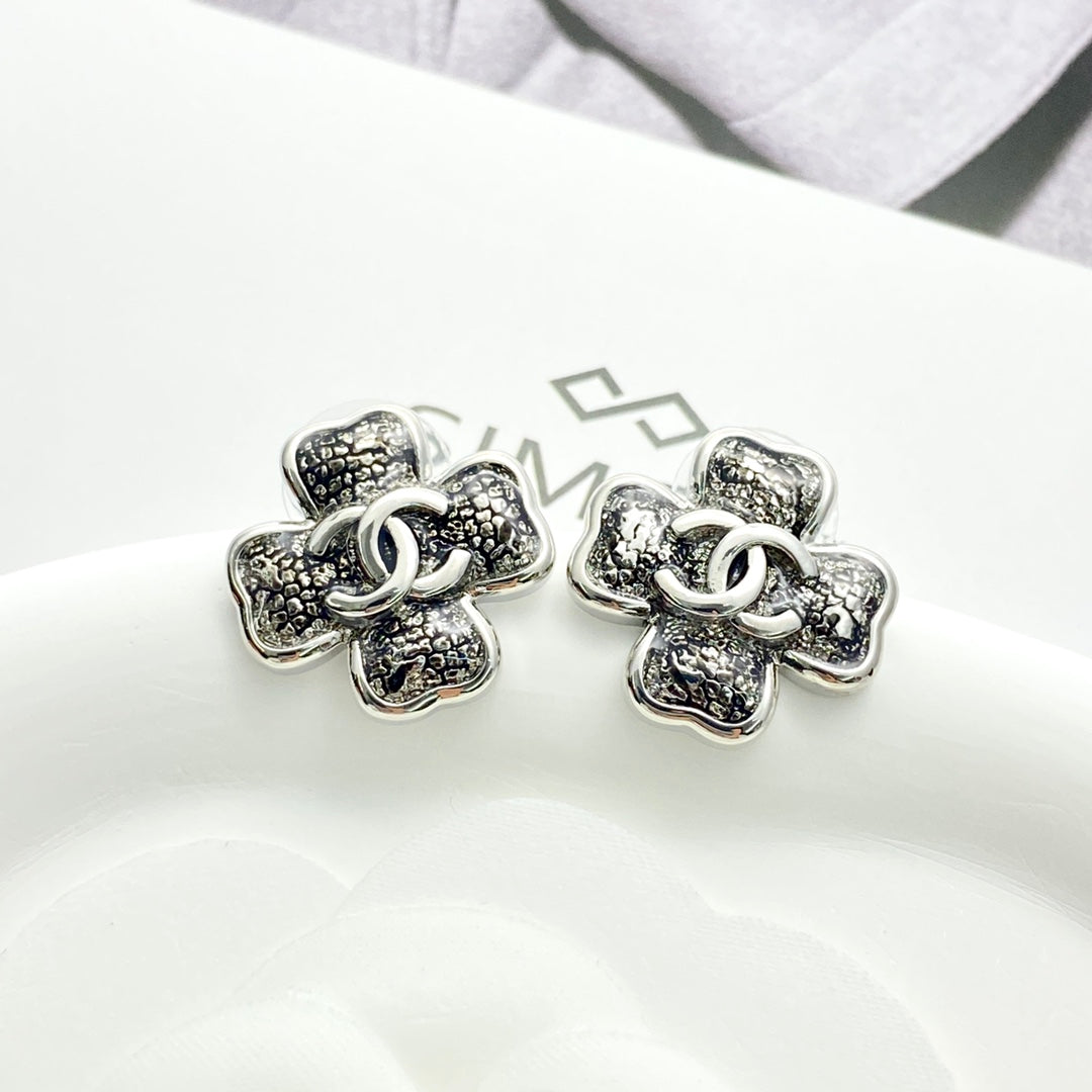 Black gold lace clover earrings