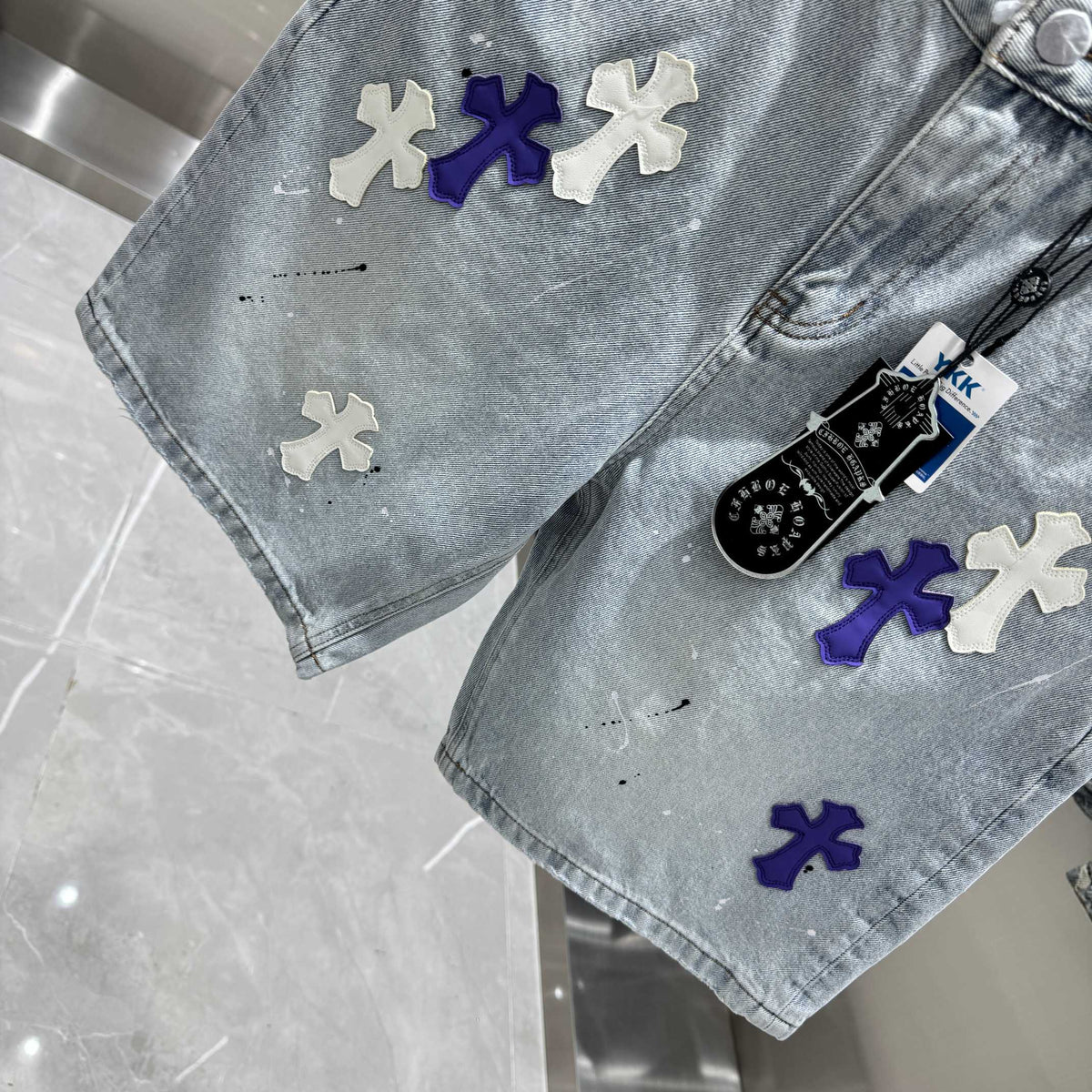 New split leather cross denim shorts