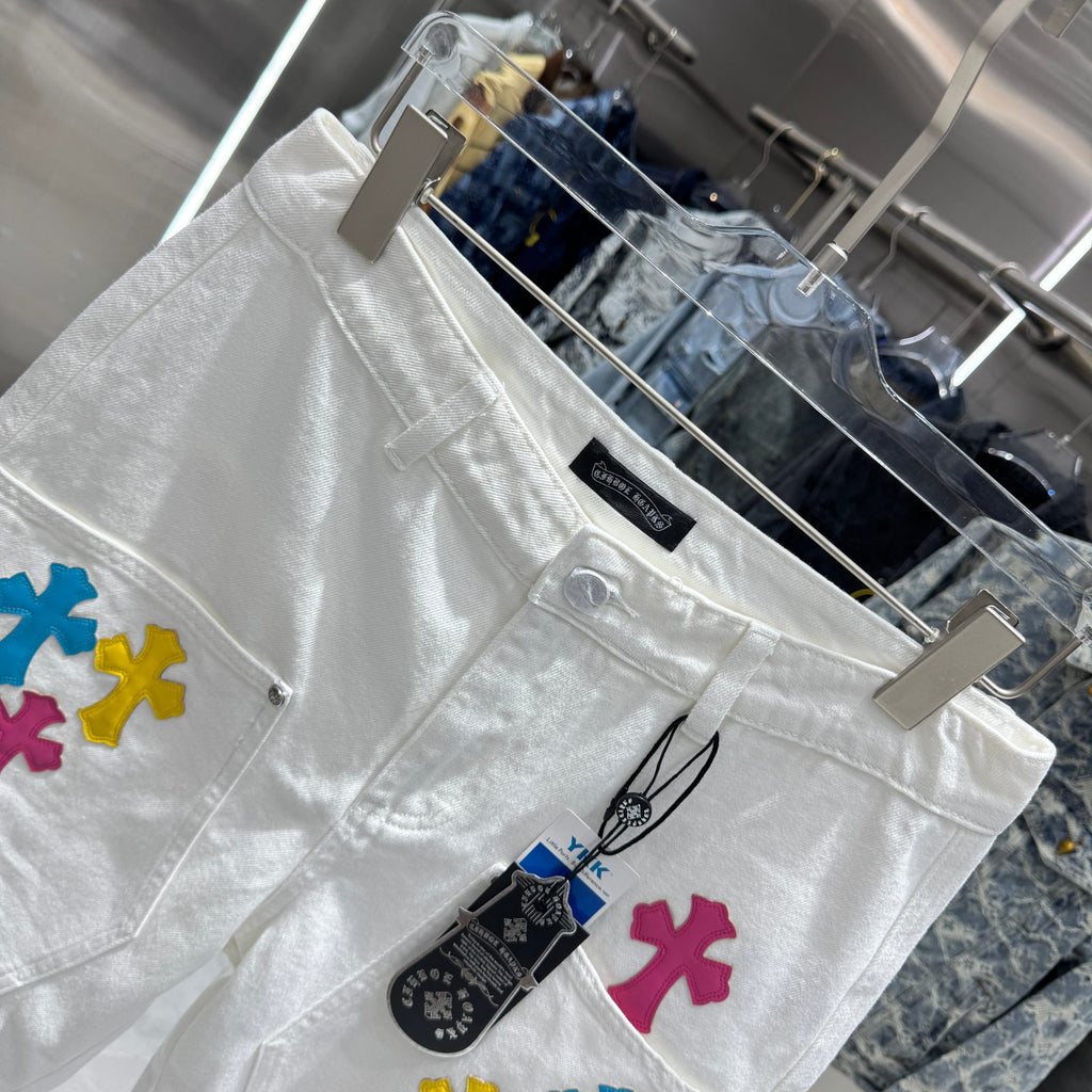 Embroidered cross denim shorts with torn holes