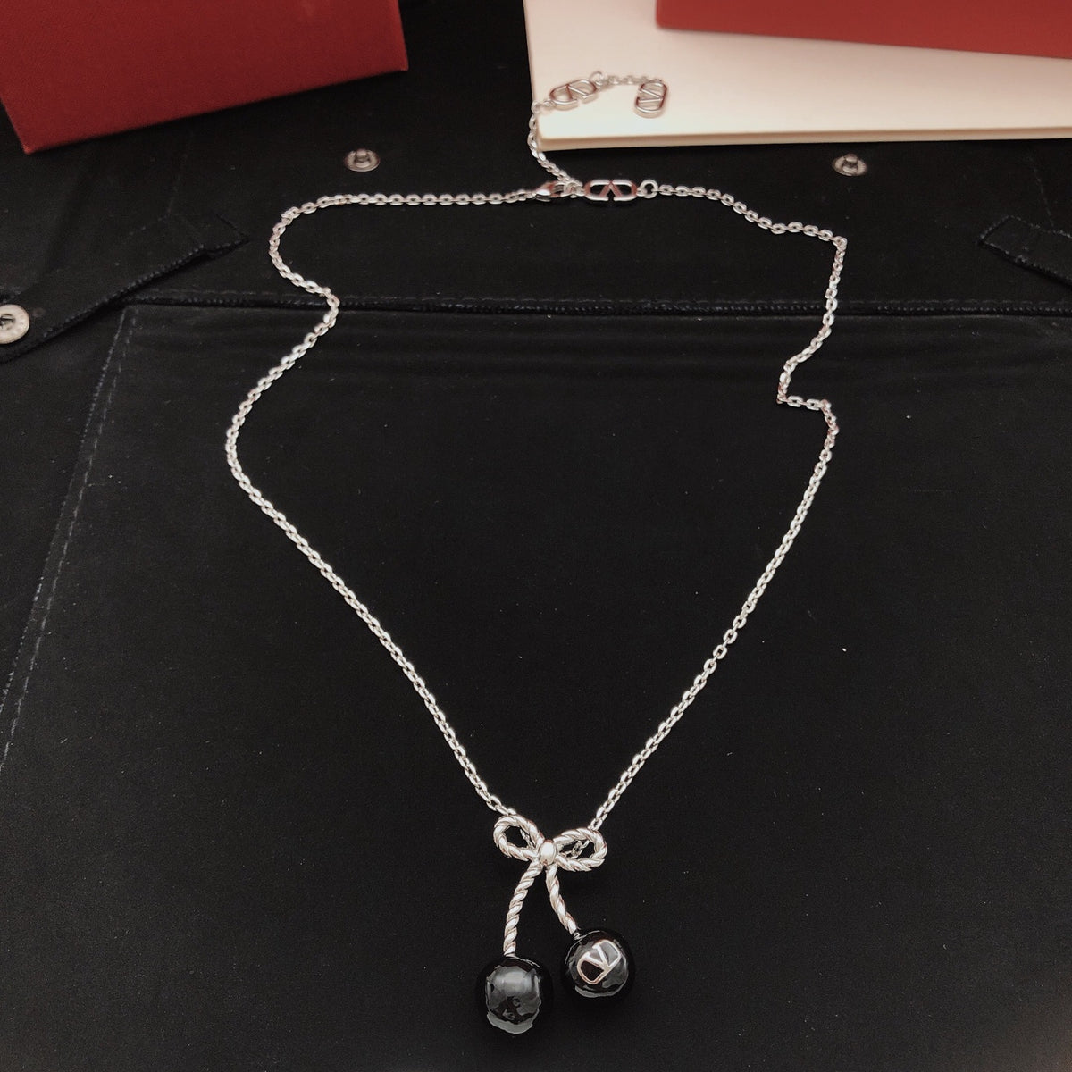 Black cherry bow necklace
