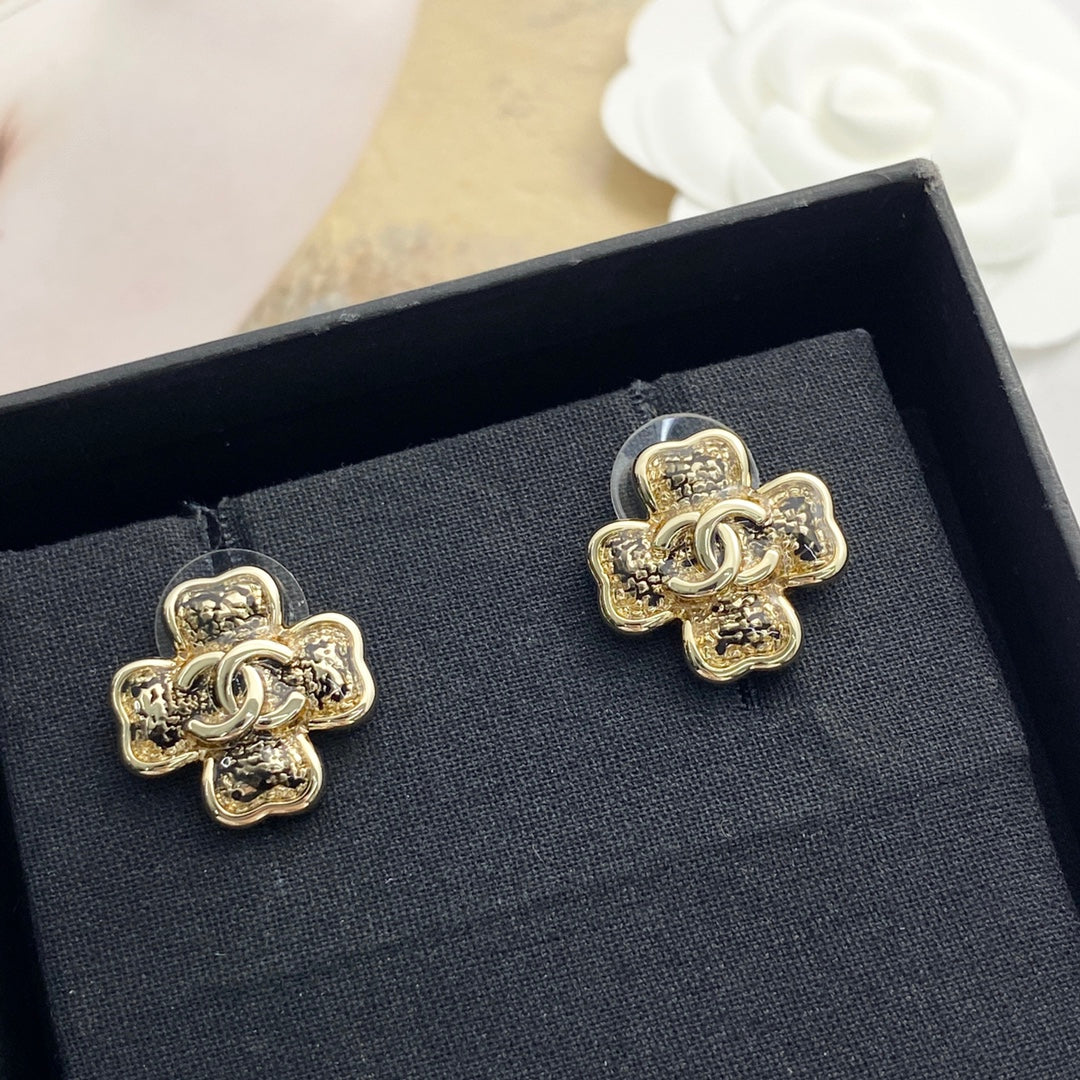 Black gold lace clover earrings