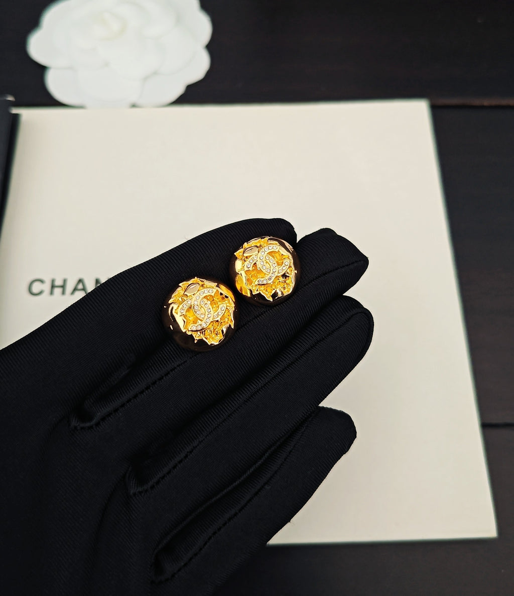 Golden spherical earrings