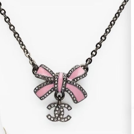 Black gold iridescent enamel bow necklace